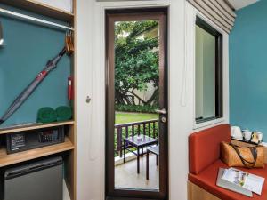 a door leading to a balcony with a view at Hotel Ibis Samui Bophut in Bophut