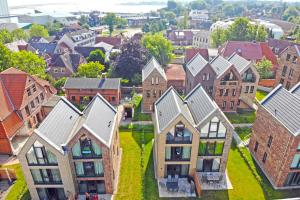 an aerial view of a town with houses at Toms Kajute in Heiligenhafen