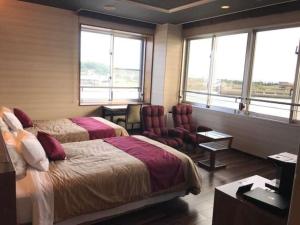 Ein Bett oder Betten in einem Zimmer der Unterkunft LiVEMAX RESORT Sakurajima Sea Front
