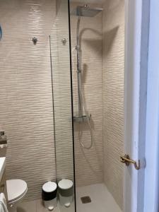 a bathroom with a shower with two stools in it at Tobago508 in Puerto Rico de Gran Canaria