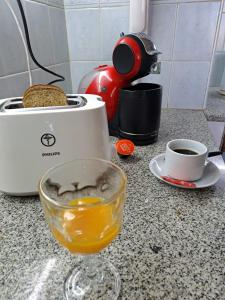 a counter with a toaster and a cup of coffee at Apartamento Rufina VII pleno centro San Luis in San Luis +20 photos