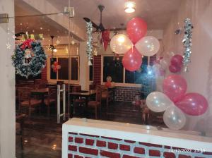 a bunch of balloons on the wall of a restaurant at Hotel StudioZ Sahastradhara in Dehradun