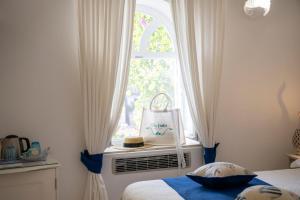 Cama ou camas em um quarto em Villa Dalu
