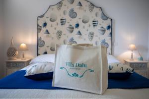 Cama ou camas em um quarto em Villa Dalu