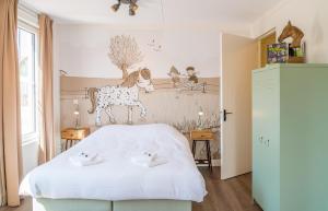 Ένα ή περισσότερα κρεβάτια σε δωμάτιο στο Familie Resort Molenwaard
