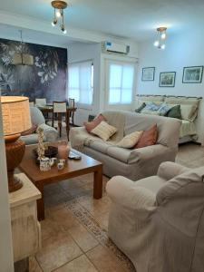 a living room with couches and a table at Apartamento Rufina VII pleno centro San Luis in San Luis