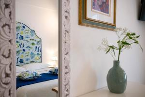 Cama ou camas em um quarto em Villa Dalu