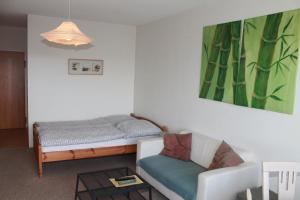 Ferienappartement K113 für 2-4 Personen in Strandnäheにあるベッド