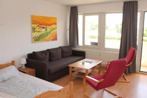 Ein Sitzbereich in der Unterkunft Ferienappartement K118 in Strandnähe