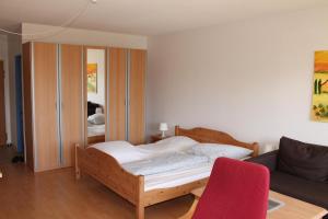Ein Bett oder Betten in einem Zimmer der Unterkunft Ferienappartement K118 in Strandnähe