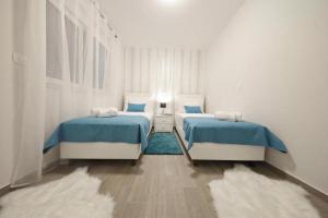 Posteľ alebo postele v izbe v ubytovaní Luxury Majpruz Suites I + 27 fotografií