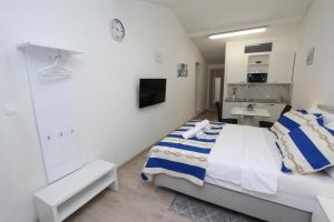 Posteľ alebo postele v izbe v ubytovaní Studio Sunny