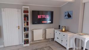 TV a/nebo společenská místnost v ubytování Ferienvilla-mv