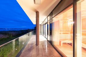 a glass house with a view at Hotel OTP Balatonszemes in Balatonszemes