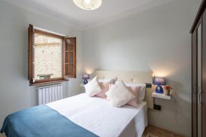 Postel nebo postele na pokoji v ubytování Pulciano Apartments