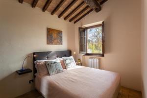 Postel nebo postele na pokoji v ubytování Pulciano Apartments