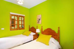 A bed or beds in a room at Finca Tropical Még 24 kép