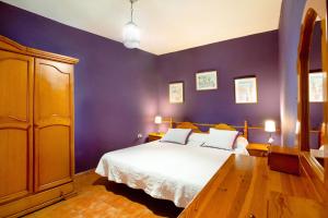 A bed or beds in a room at Finca Tropical