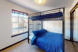 a bedroom with a bunk bed and a window at Hideaway Harbor in Holiday Island