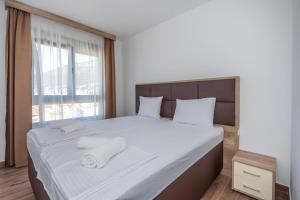 Voodi või voodid majutusasutuse Hotel Pharos toas