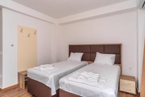 Voodi või voodid majutusasutuse Hotel Pharos toas