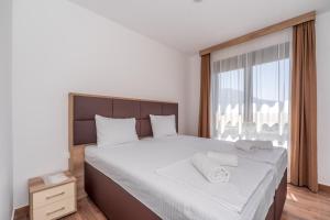 Voodi või voodid majutusasutuse Hotel Pharos toas