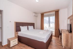 Voodi või voodid majutusasutuse Hotel Pharos toas