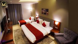 Letto o letti in una camera di Muscat Express Hotel