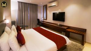 TV o dispositivi per l'intrattenimento presso Muscat Express Hotel