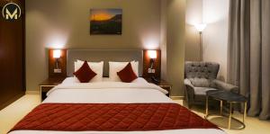 Letto o letti in una camera di Muscat Express Hotel