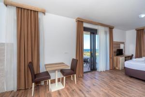 Voodi või voodid majutusasutuse Hotel Pharos toas