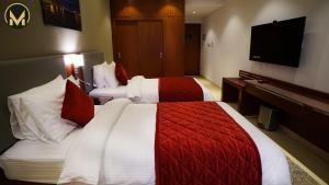 Letto o letti in una camera di Muscat Express Hotel