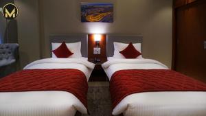 Letto o letti in una camera di Muscat Express Hotel