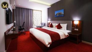 Letto o letti in una camera di Muscat Express Hotel