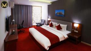 Letto o letti in una camera di Muscat Express Hotel