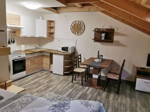 Apartmány Nová duha Vavřinec 주방 또는 간이 주방