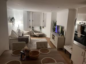 a living room with a couch and a table at Gorgeous 2 floor 3 bed Apartment in St. Leonards