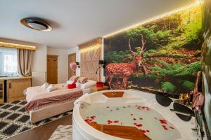 Posteľ alebo postele v izbe v ubytovaní Serce Tatr Residence Zakopane - blisko Krupówek