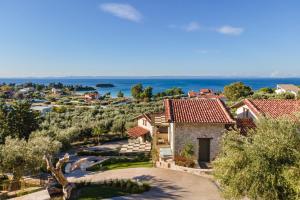 an aerial view of a house with the ocean in the background at Kastri Elia Suites in Nikiti