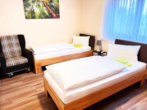 Postel nebo postele na pokoji v ubytování FeWo-Zimmer-Auszeit
