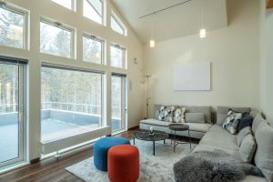 a living room with a couch and a tub at Blue Heron in Rusutsu