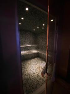 a view of a room with a staircase through a door at Hôtel Aalborg in Les Deux Alpes