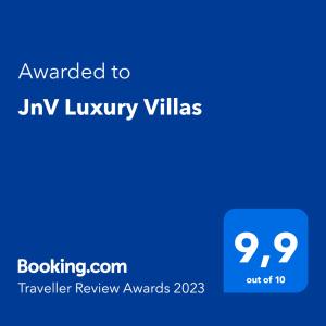 a blue screen with the text awarded to icy luxury villas at JnV Luxury Villas in Chania Town