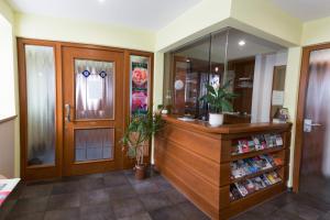 a room with a pharmacy with a counter and a mirror at Landgasthof Schützen in Tengen