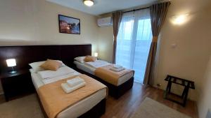 Postel nebo postele na pokoji v ubytování Hotel Villa Panorama