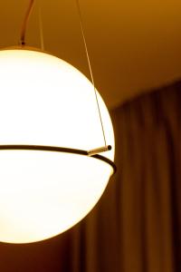 a pair of lights hanging from a ceiling at Exarcheia Vibe Penthouse 1 in Athens