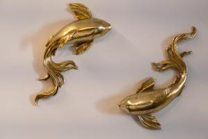a gold fish and a dolphin statuette at Exarcheia Vibe Penthouse 1 in Athens