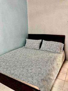 Säng eller sängar i ett rum på SUPER COMFY HOME @ KULIM CITY