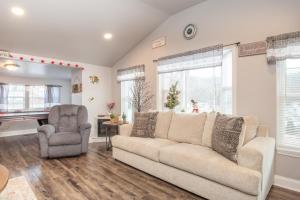 a living room with a couch and a chair at Blue Mountain Bungalow 