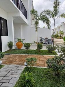 a house with a garden with at Natalie's Villa in Iloilo City